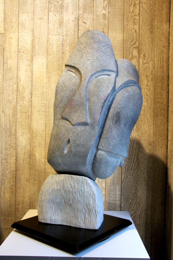 Narwhal Faces Billy Merkosak Inuit art sculpture basalt