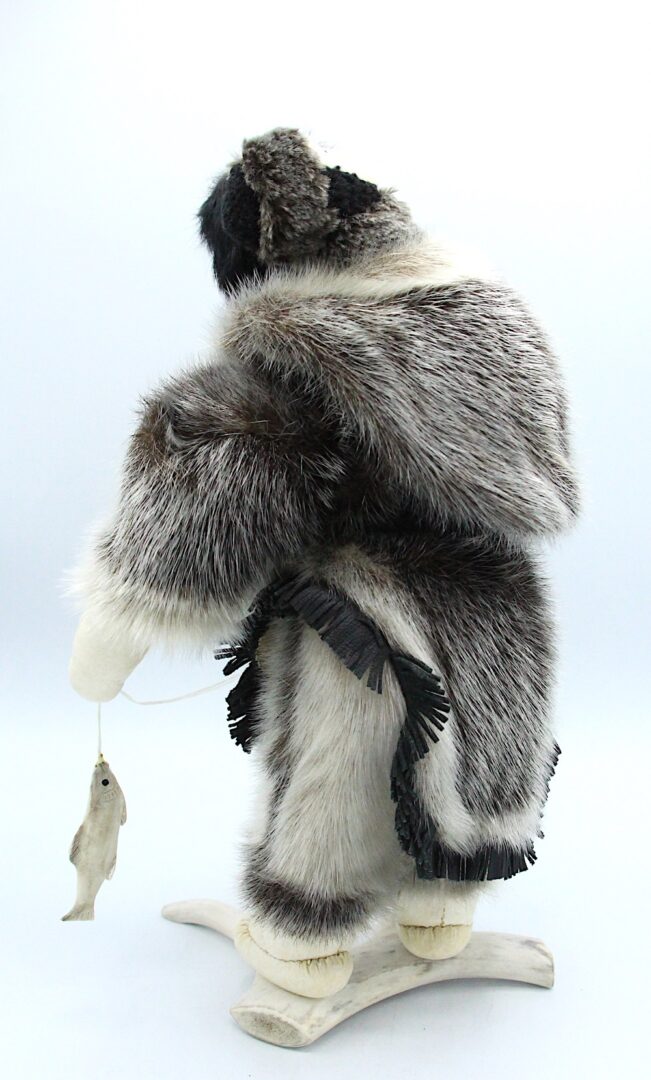 Inuit art doll in seal skin