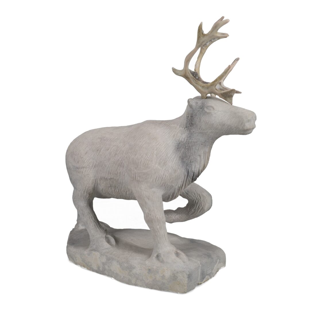 One original hand-carved sculpture by Inuit artist, Billy Merkosak. One caribou carved out of white marble and antler.