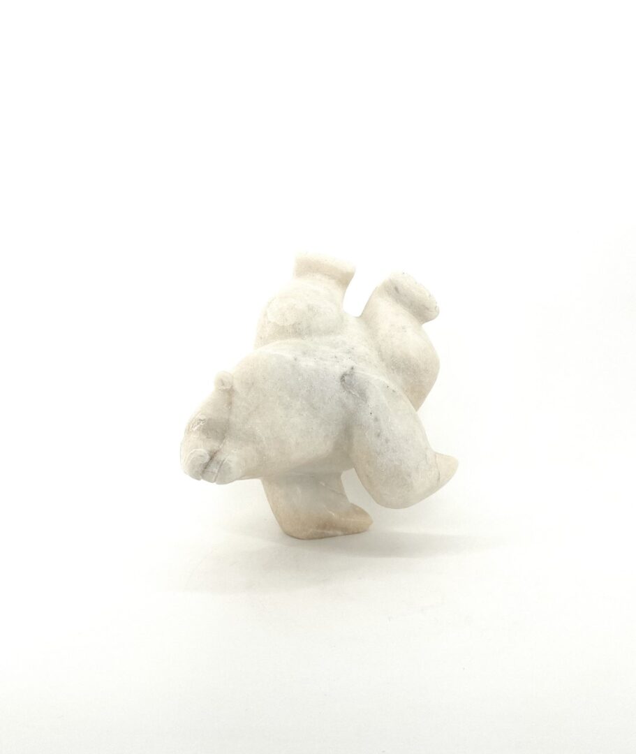 Original Inuit Art sculpture hand carved by Isaaci Petaulassie in Cape Dorset, 2019. Two Way Bear 7339M made in white marble.