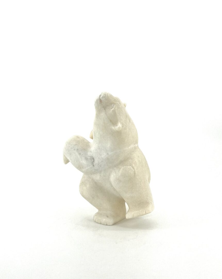 Original Inuit Art sculpture hand carved by Isaaci Petaulassie in Cape Dorset, 2019. Two Way Bear 7339M made in white marble.
