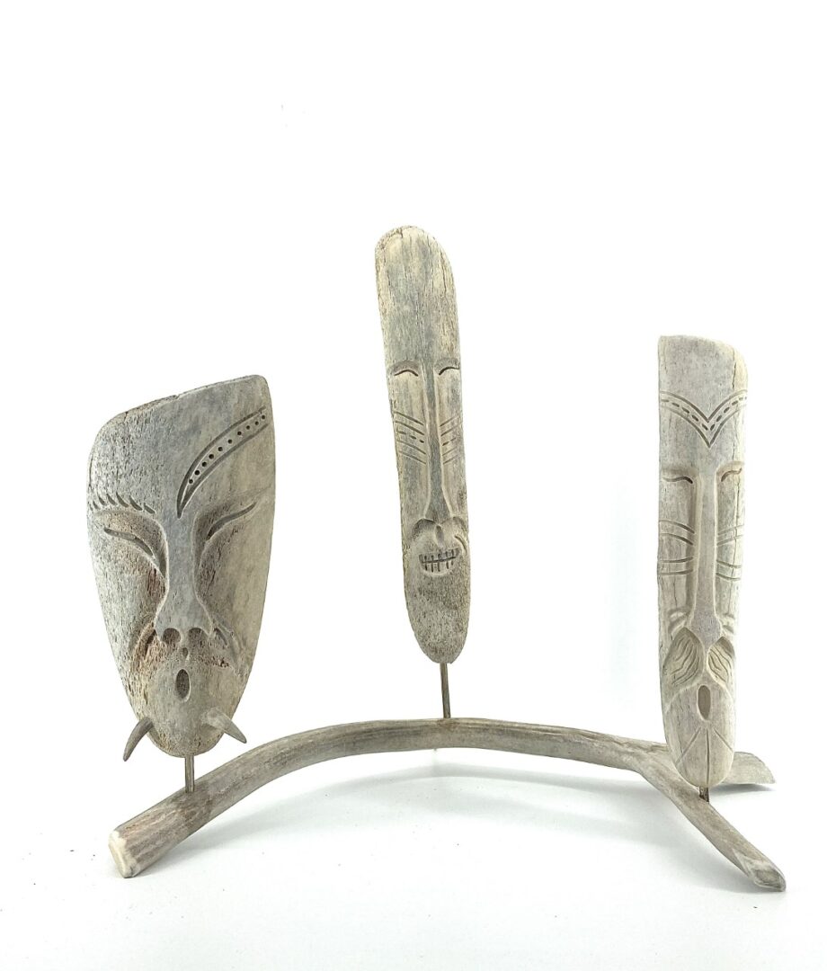 original inuit art sculpture in whale bone and caribou antler by Billy Merkosak from Pond Inlet, Nunavut sculpted in 2019