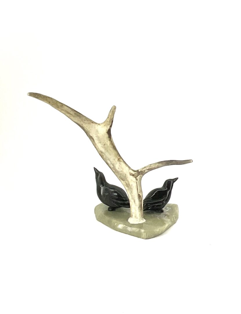One original inuit hand carved sculpture made by Peter John Mitchell in serpentine, caribou antler and basalt ''Two Birds 234462''.