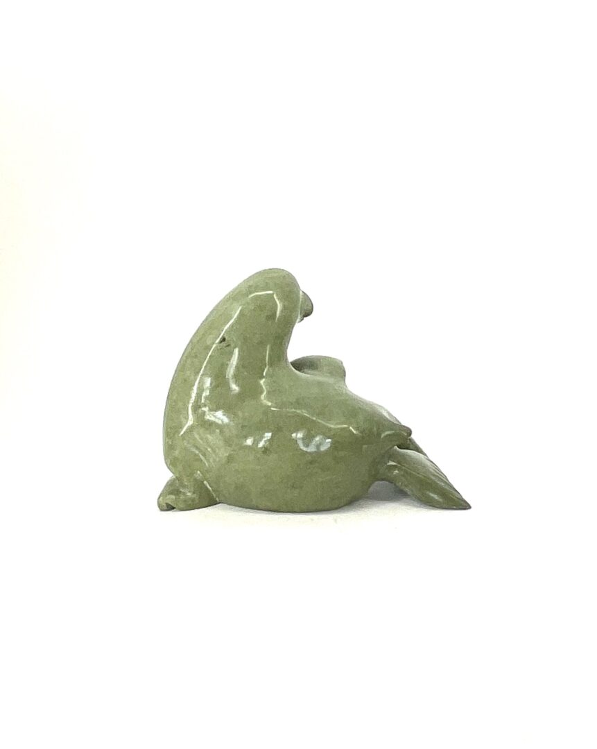 One original inuit art sculpture hand carved by Pea Micheal from Kimmirut, Nunavut in green serpentine ''Seal 836020395''.