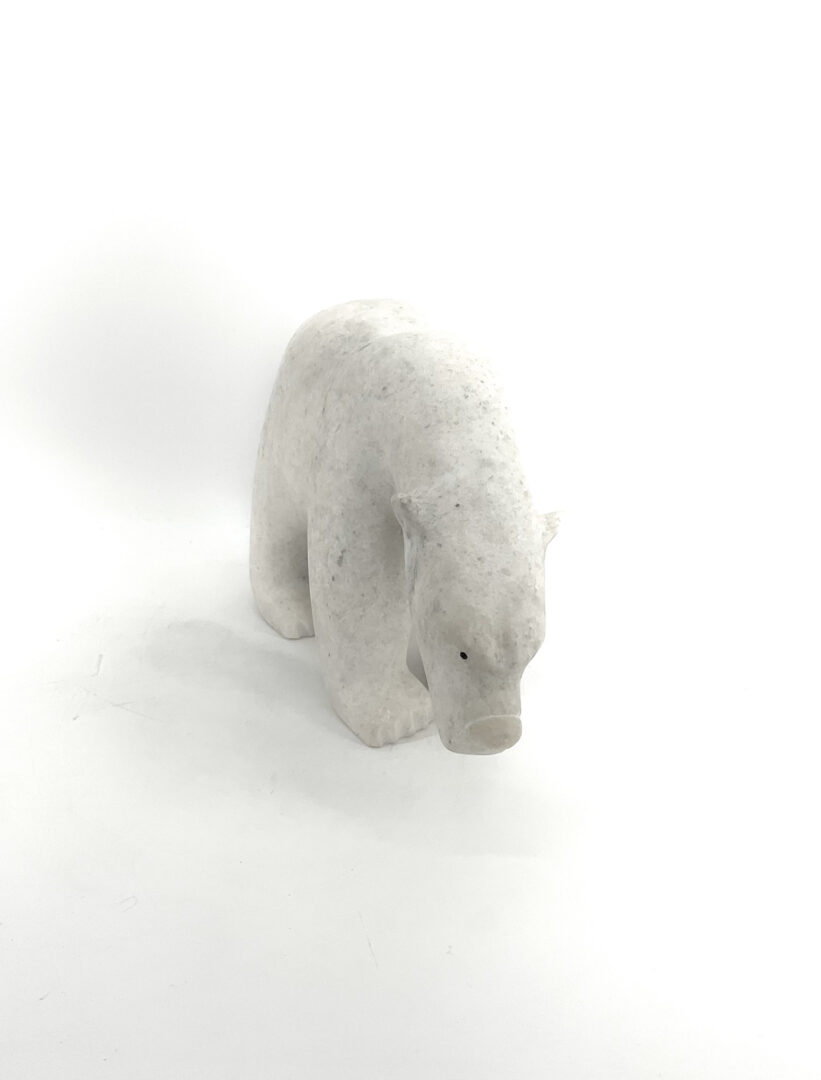 One original Inuit art sculpture hand carved out of white marble stone by Adamie from Cape Dorset, Nunavut.