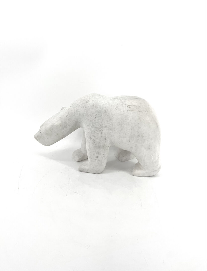 One original Inuit art sculpture hand carved out of white marble stone by Adamie from Cape Dorset, Nunavut.