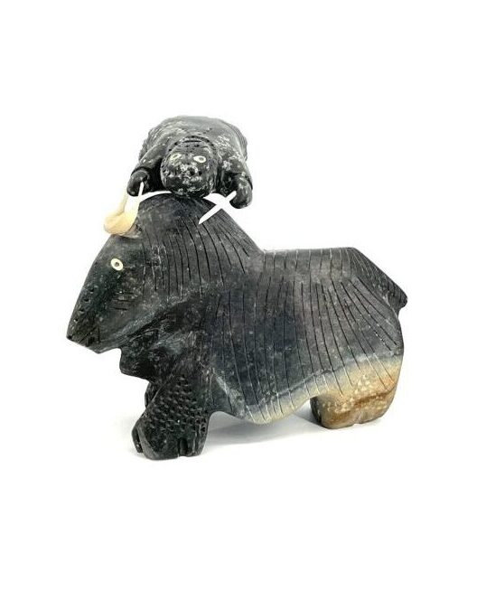 One original Inuit art ''Muskox Tossing Hunter''sculpture hand carved out of serpentine stone from Nunavut.