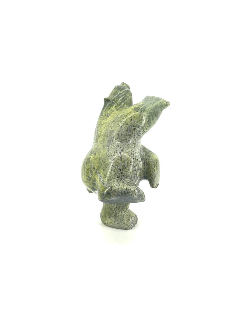 One original Inuit sculpture hand carved by Johnny Manning from Iqaluit, Nunavut. Bear made out of green serpentine.