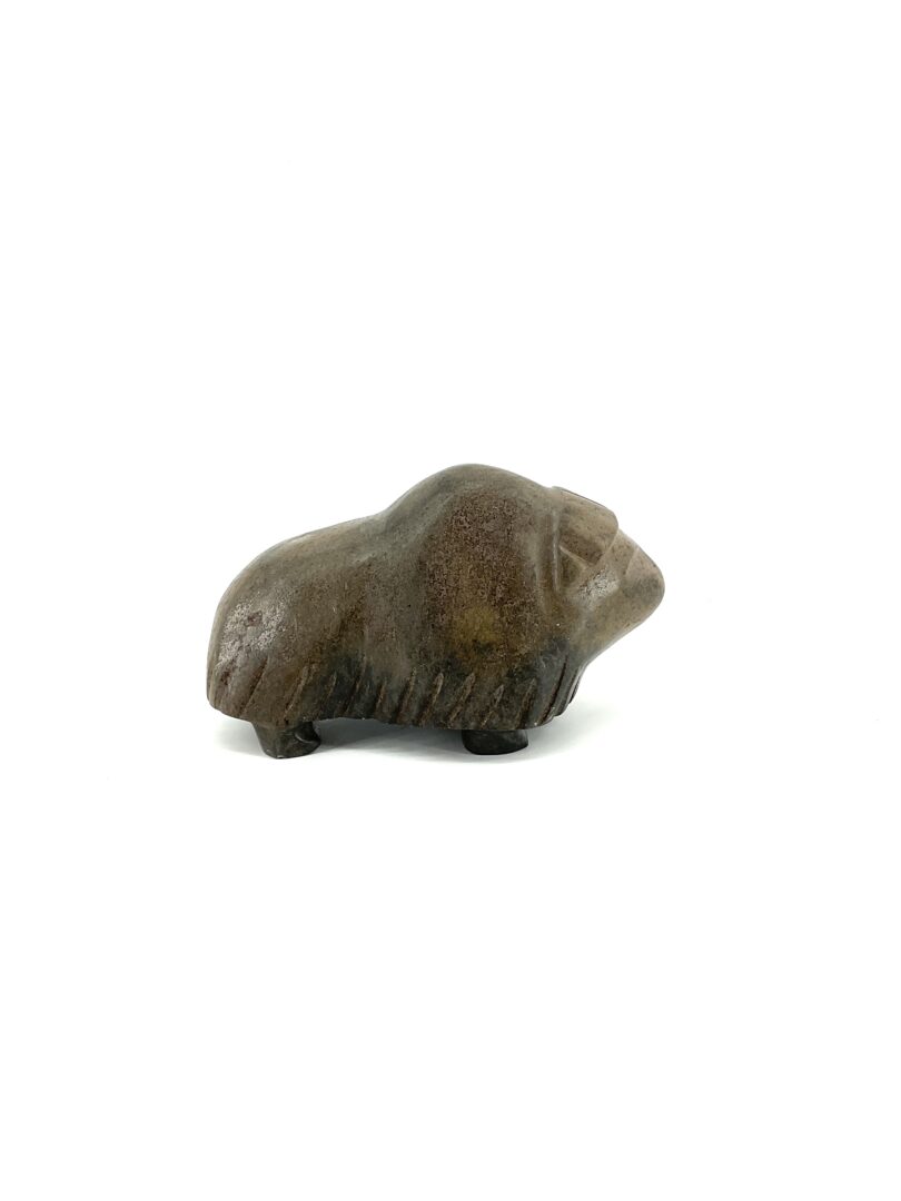One original hand-carved sculpture by Kupapik Ningeocheak from Coral Harbour, Nunavut. One musk-ox made out of basalt.