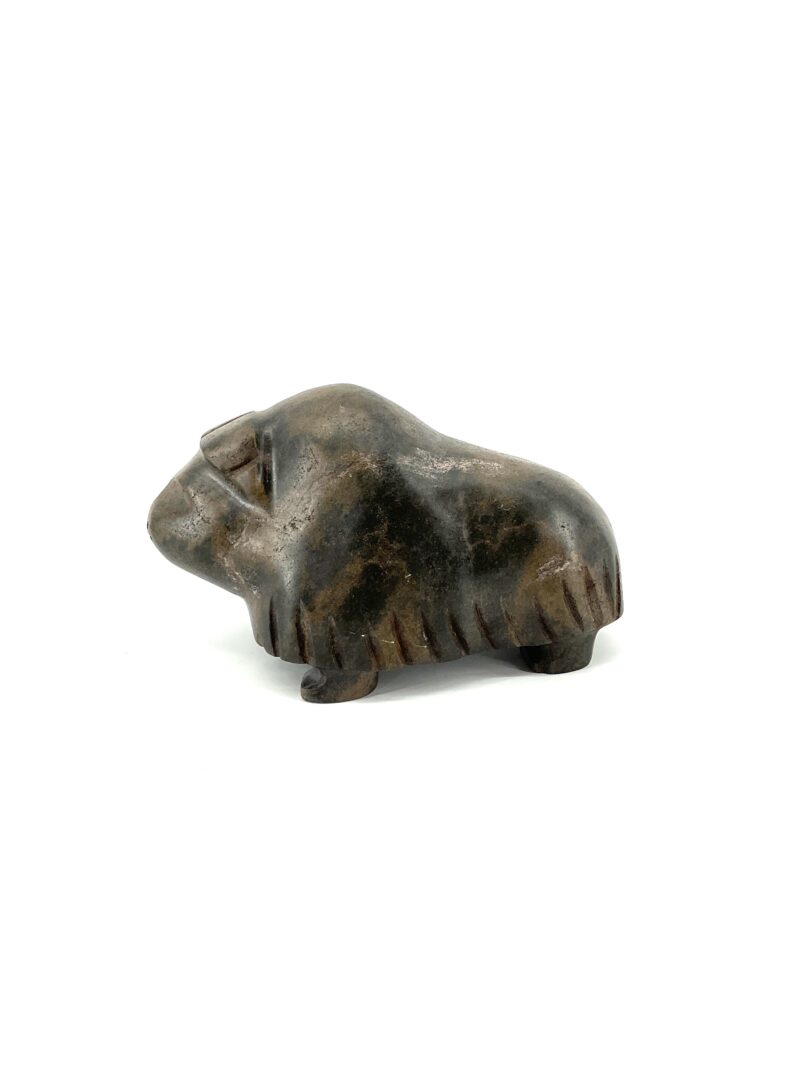 One original hand-carved sculpture by Kupapik Ningeocheak from Coral Harbour, Nunavut. One musk-ox made out of basalt.