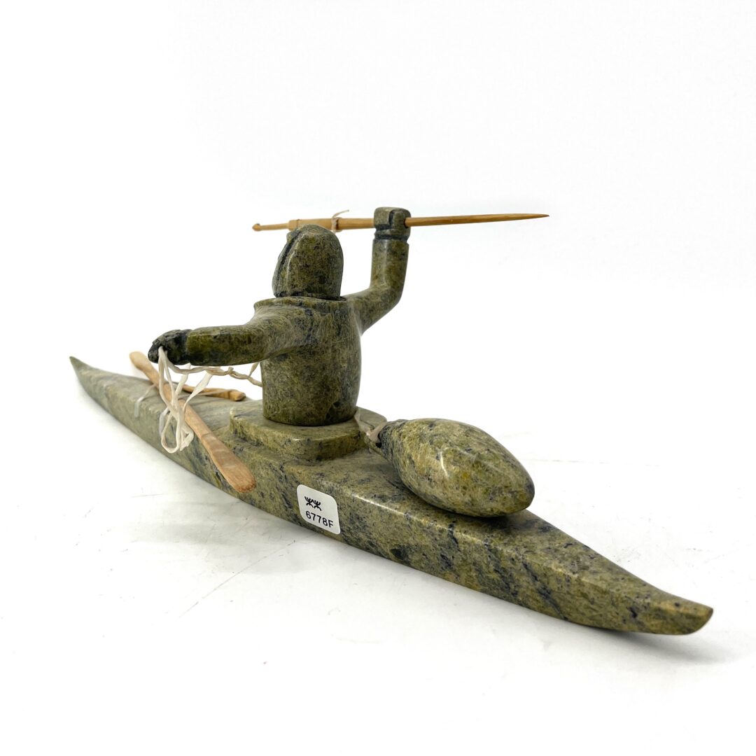 e original hand-carved sculpture by Noah Jaw from Cape Dorset, Nunavut. Kayaker sculpture made out of serpentine.