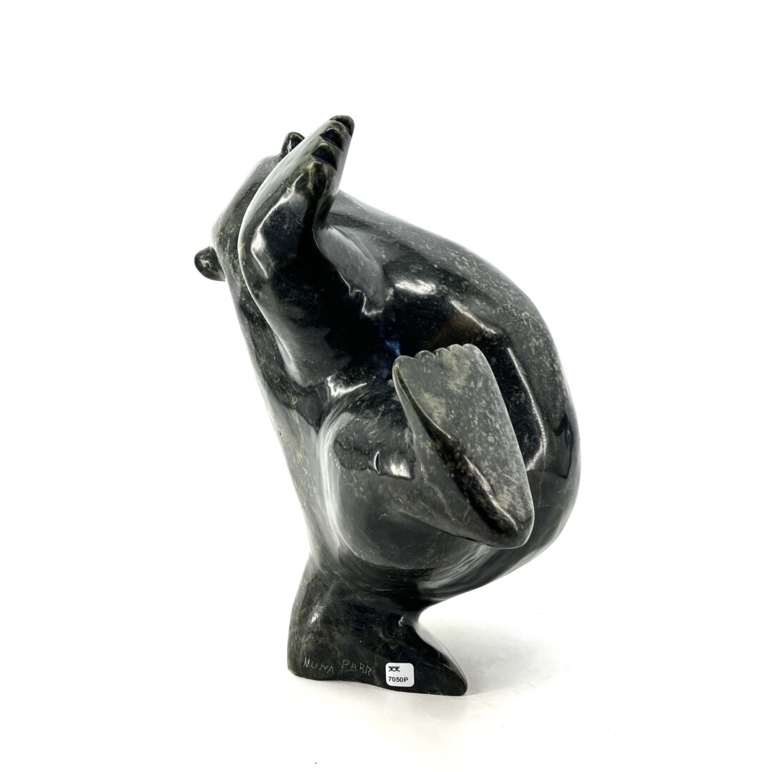 One original hand-carved sculpture by Nuna Parr from Cape Dorset, Nunavut. One dancing bear carved out of serpentine.