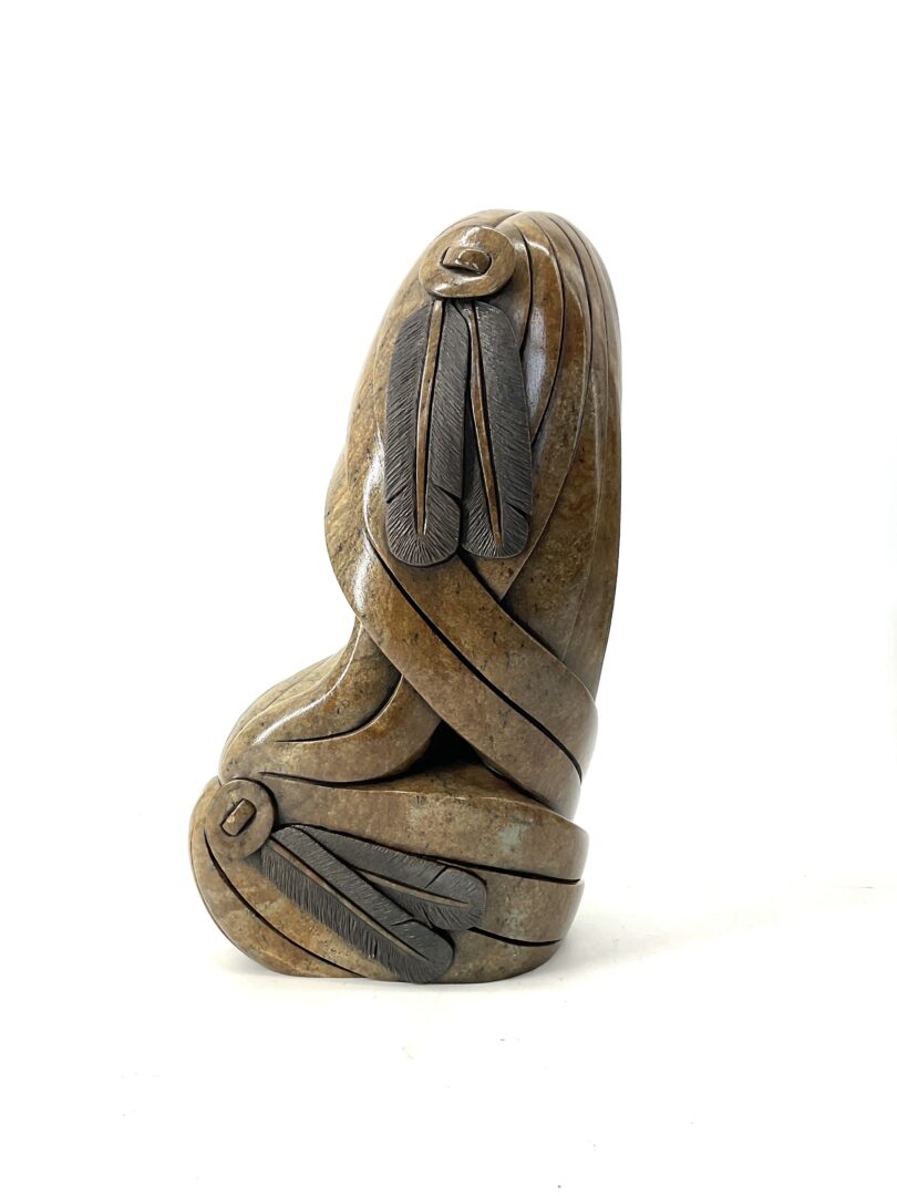 One original hand-carved sculpture by Iroquois artist Cyril Henry. Twin spirits sculpture made out of soapstone.