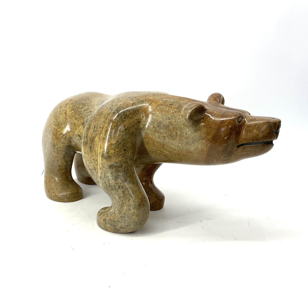 One original hand-carved sculpture by Mohawk artist Dale Isaacs. One walking bear sculpture made out of soapstone.