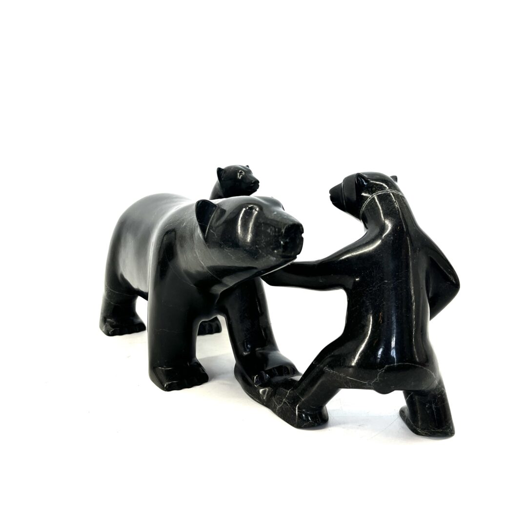One original hand-carved sculpture by Inuit artist Kooyoo Peter. Mother and cubs sculpture made out of black serpentine.