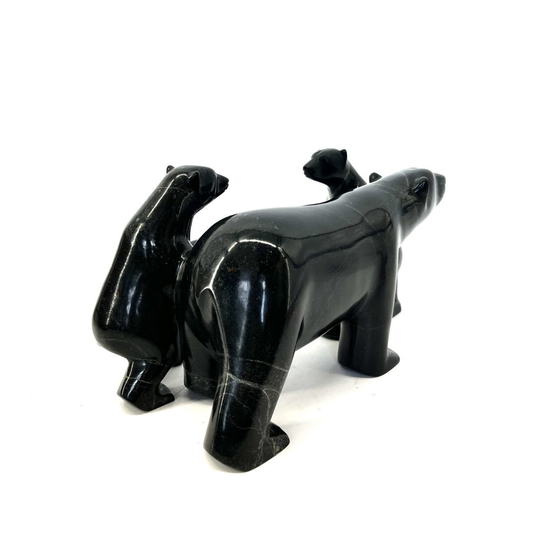 One original hand-carved sculpture by Inuit artist Kooyoo Peter. Mother and cubs sculpture made out of black serpentine.