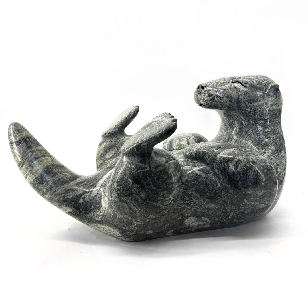 One original hand-carved sculpture by Ojibway artist, Paul Bruneau. One otter sculpted out of serpentine stone.