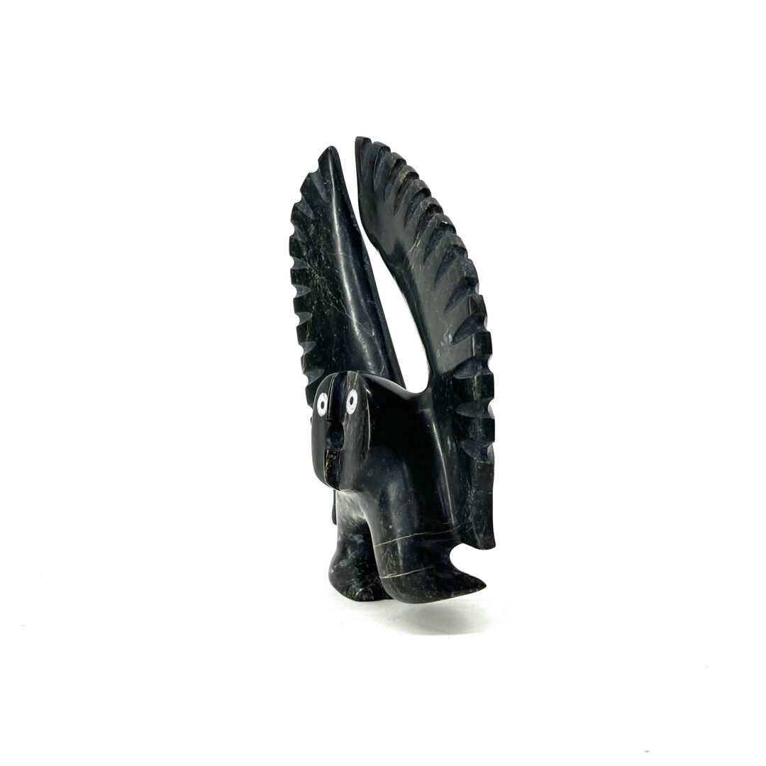 One original hand-carved sculpture by Inuit artist, Palaya Qiatsuq. One dancing owl sculpture made out of serpentine.