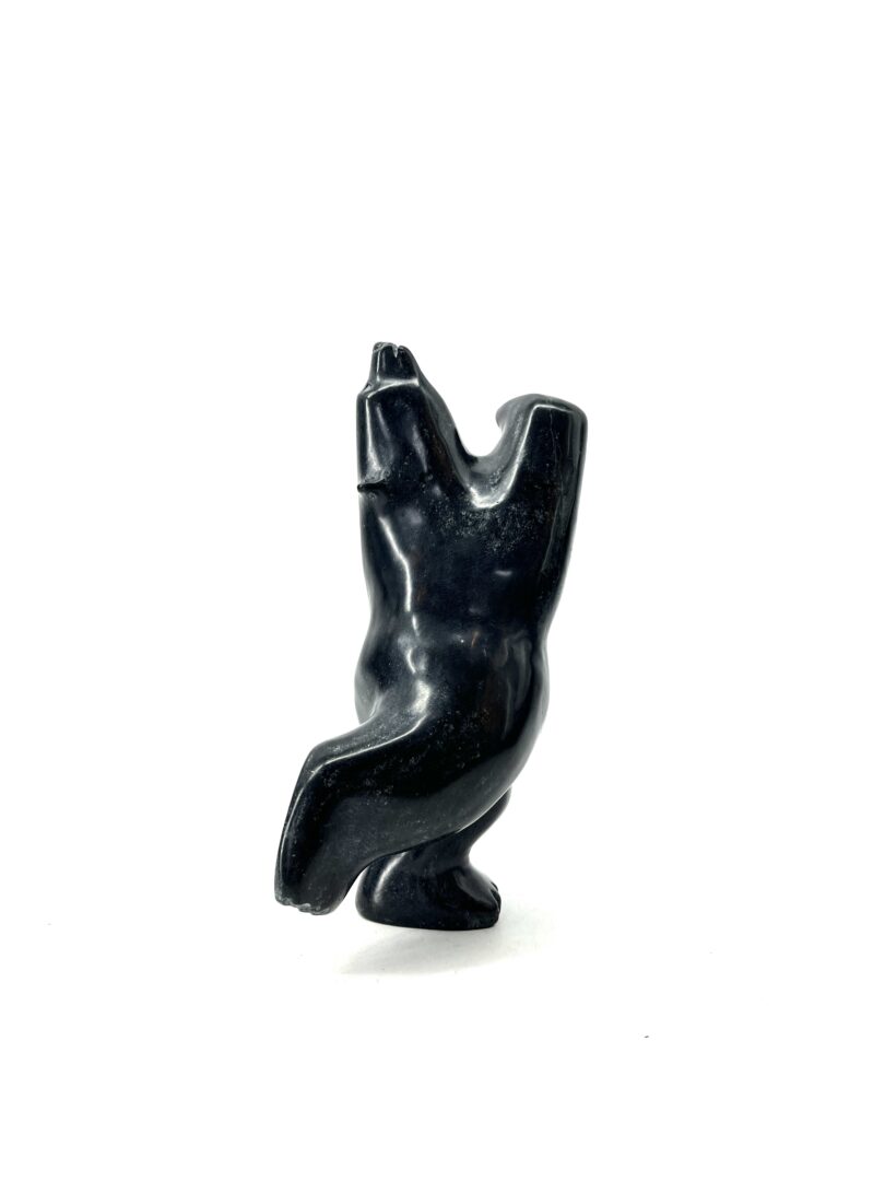 One original hand-carved sculpture by Inuit artist, Johnny Manning. One dancing bear made out of serpentine.