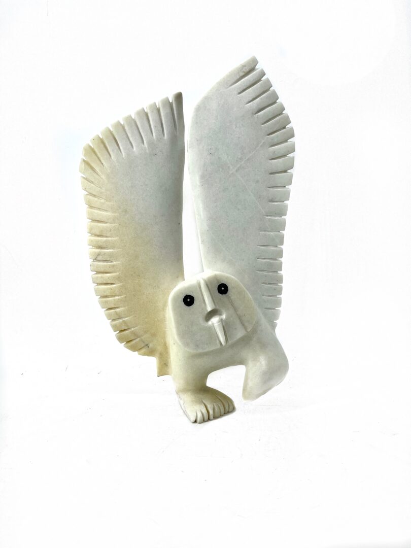 One original hand-carved sculpture by Inuit artist Palaya Qiatsuq. One snowy owl sculpted out of white marble.