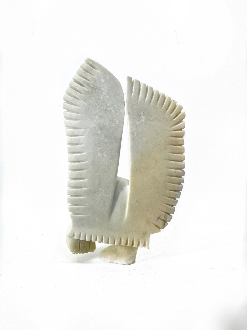 One original hand-carved sculpture by Inuit artist Palaya Qiatsuq. One snowy owl sculpted out of white marble.