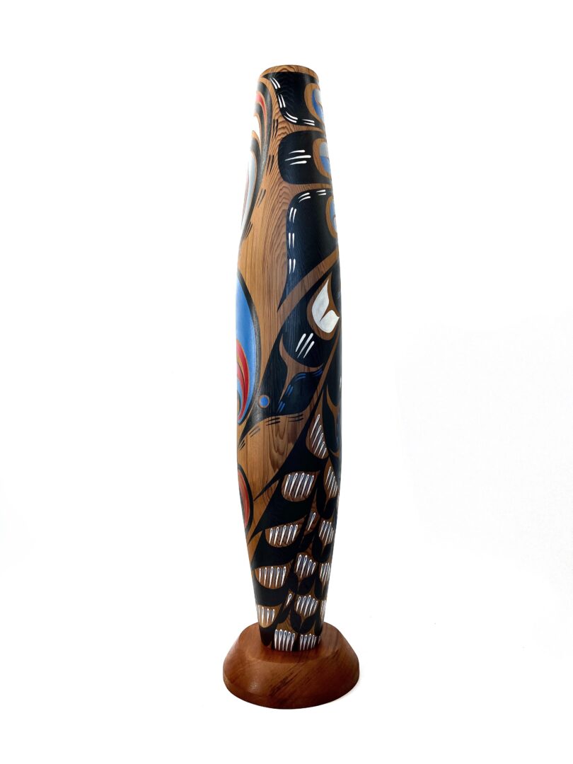 One original hand-carved cradle rattle by Kwakwak'wakw artist, Johnathan Henderson. One Kulus design cradle rattle.