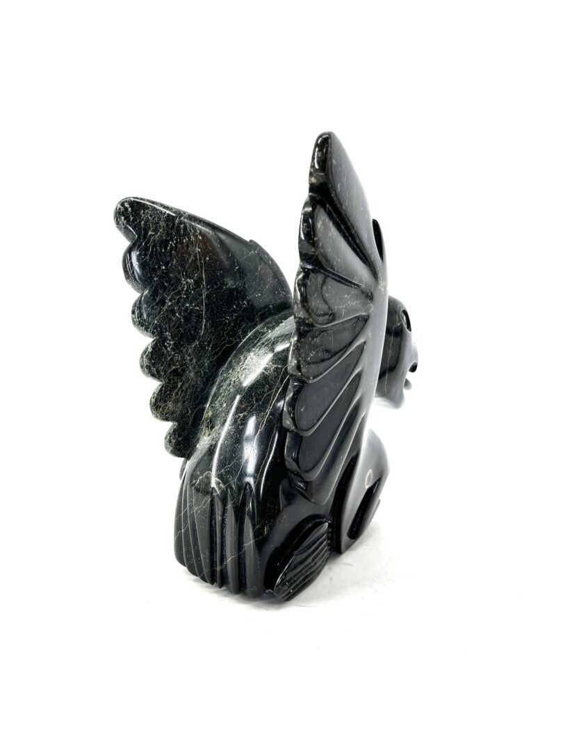 One original hand-carved sculpture by Inuit artist Toonoo Sharky. One composition piece made out of serpentine.
