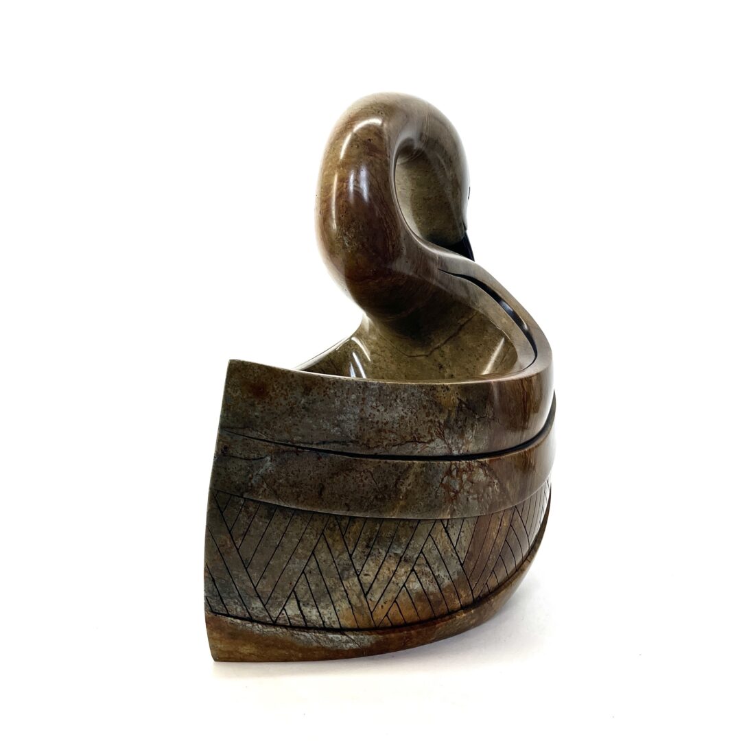 One original hand-carved sculpture by Iroquois artist, Eric Silver. One swan sculpture carved out of soap stone.
