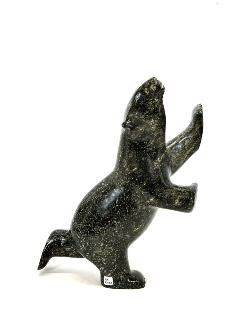 One original hand-carved sculpture by Inuit artist, Ashevak Adla. One dancing bear sculpture made out of serpentine.