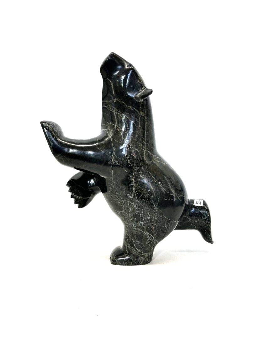 One original hand-carved sculpture by Inuit artist, Ashevak Adla. One dancing bear made out of serpentine.