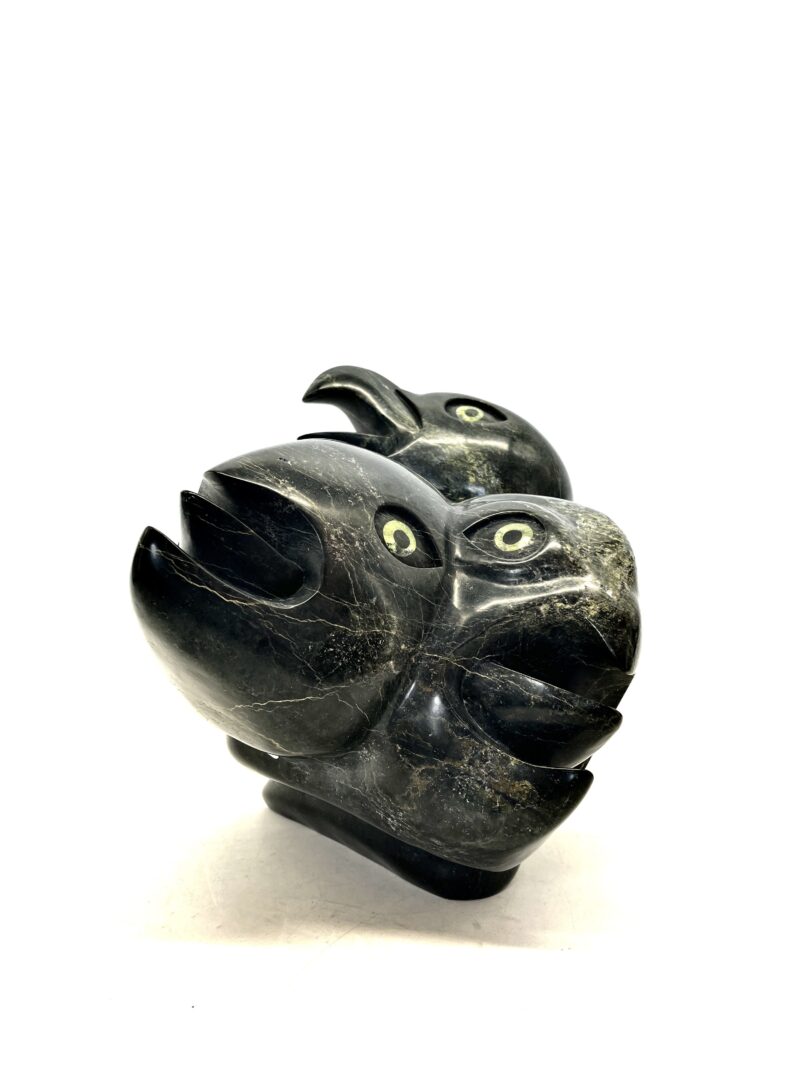 One original hand-carved sculpture by Inuit artist, Toonoo Sharky (RCA). One heads transformation made out of serpentin