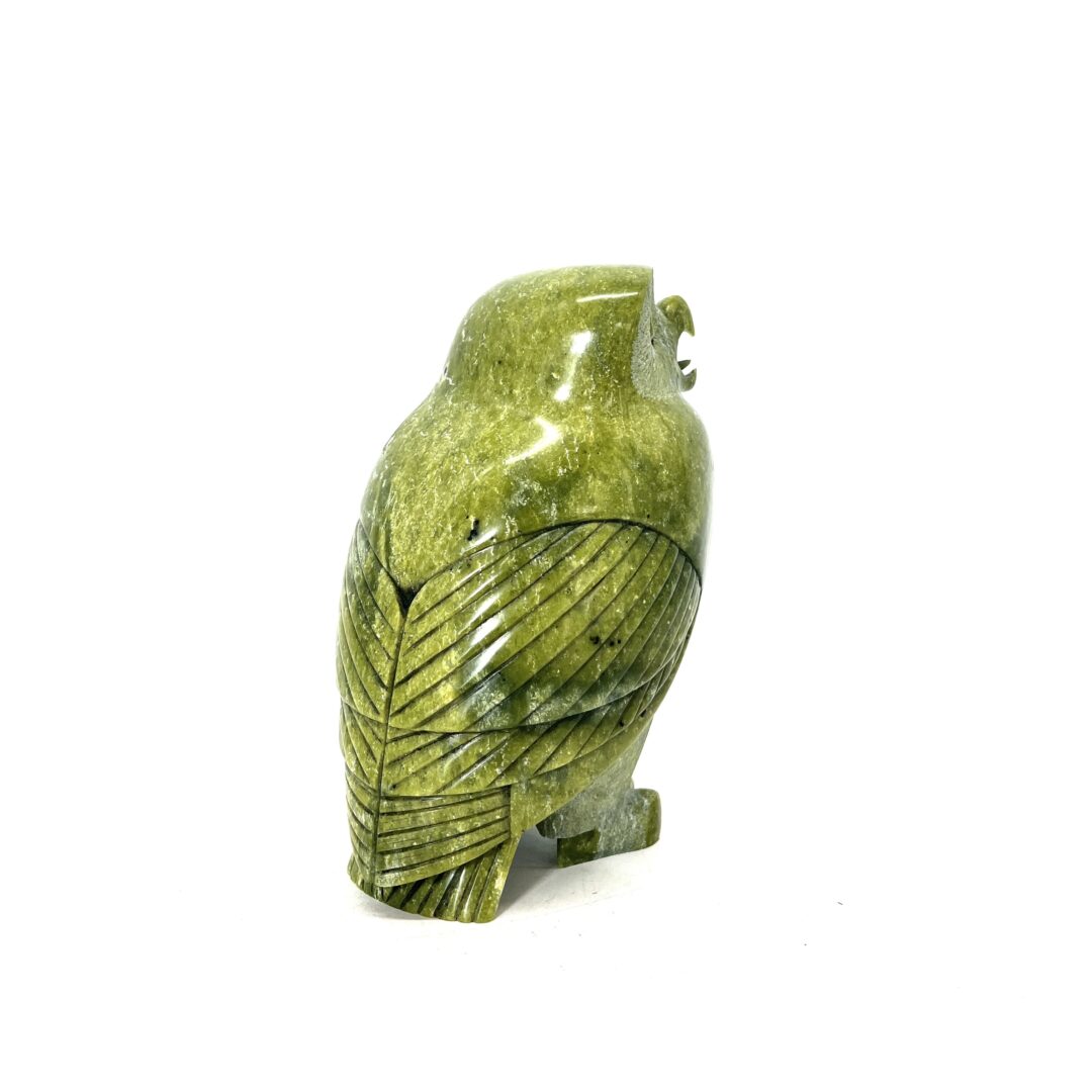 One original hand-carved sculpture by Inuit artist, Pits Qimirpik. One owl sculpture carved out of serpentine.