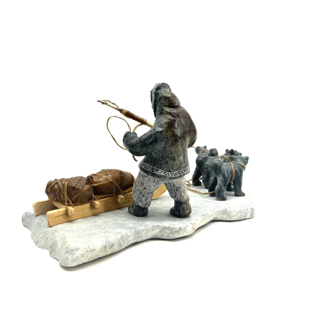 e original hand-carved sculpture by Inuit artist, Peter Smith. One hunting scene sculpted out of soapstone.