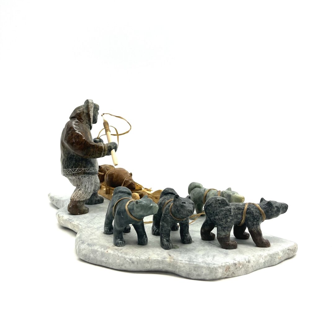 e original hand-carved sculpture by Inuit artist, Peter Smith. One hunting scene sculpted out of soapstone.