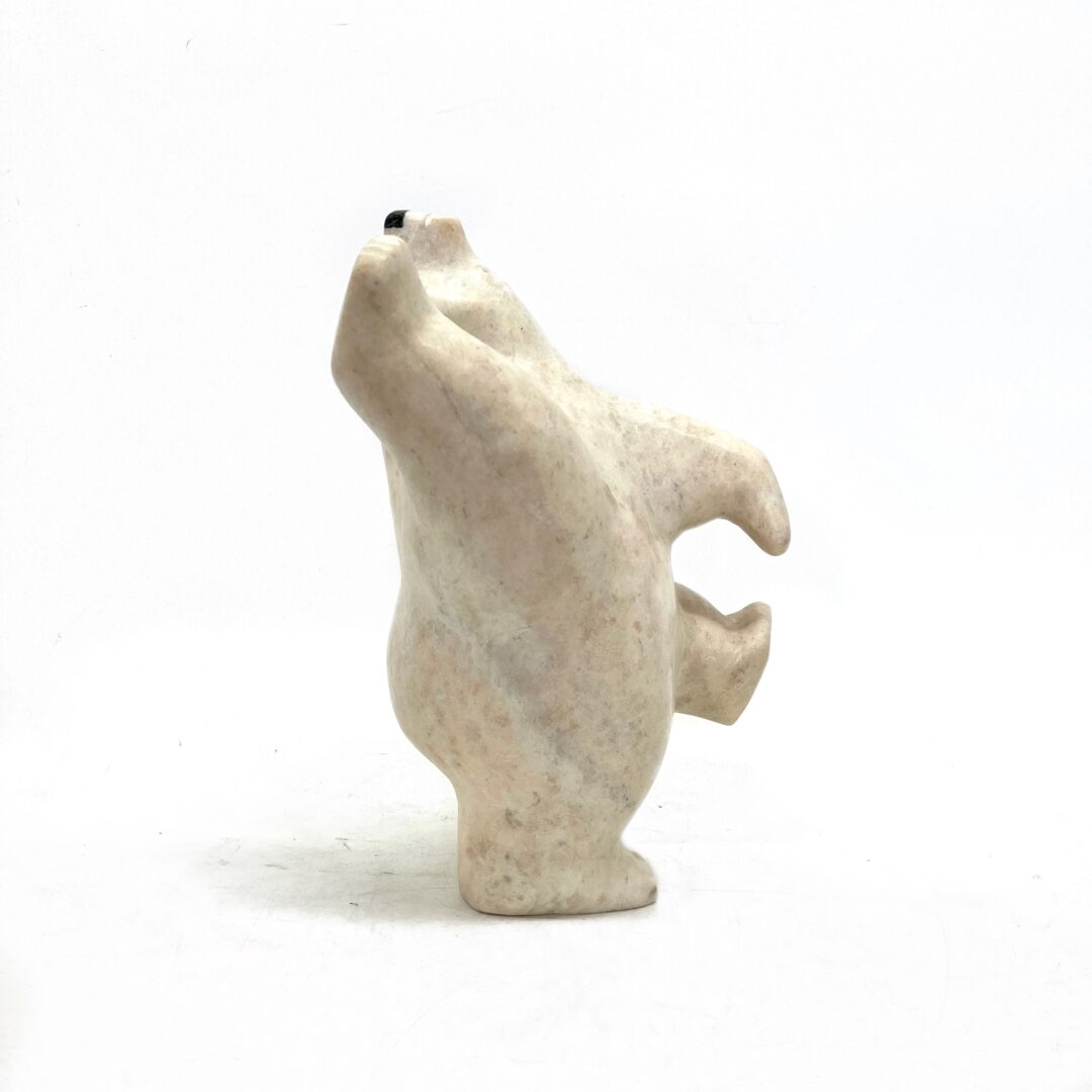 One original hand-carved sculpture bu Inuit artist, Moe Pootoogook. One dancing bear made out of white marble.