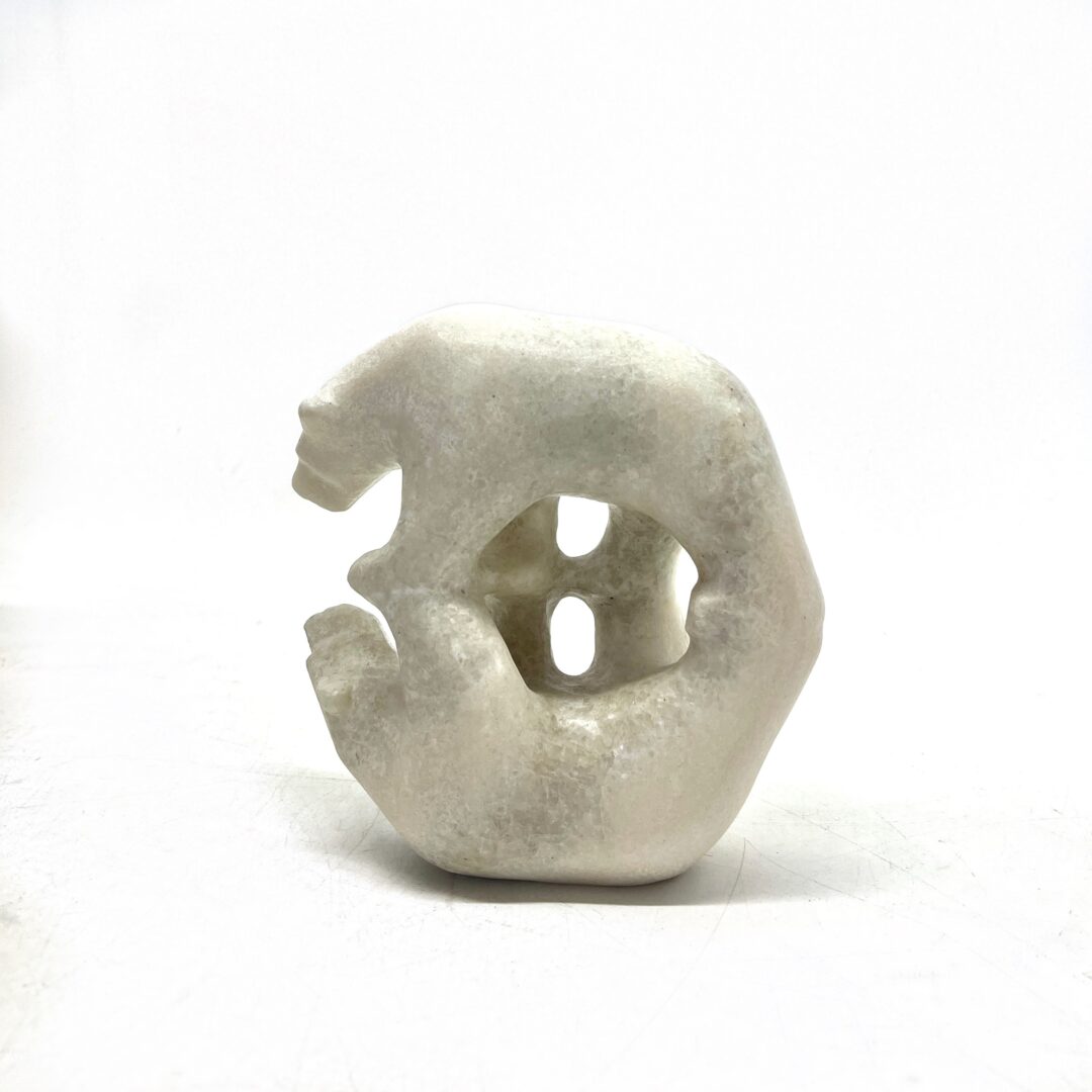 One original hand-carved sculpture by Inuit artist, Tony Oqutaq. One mirror bear sculpted out of white marble.