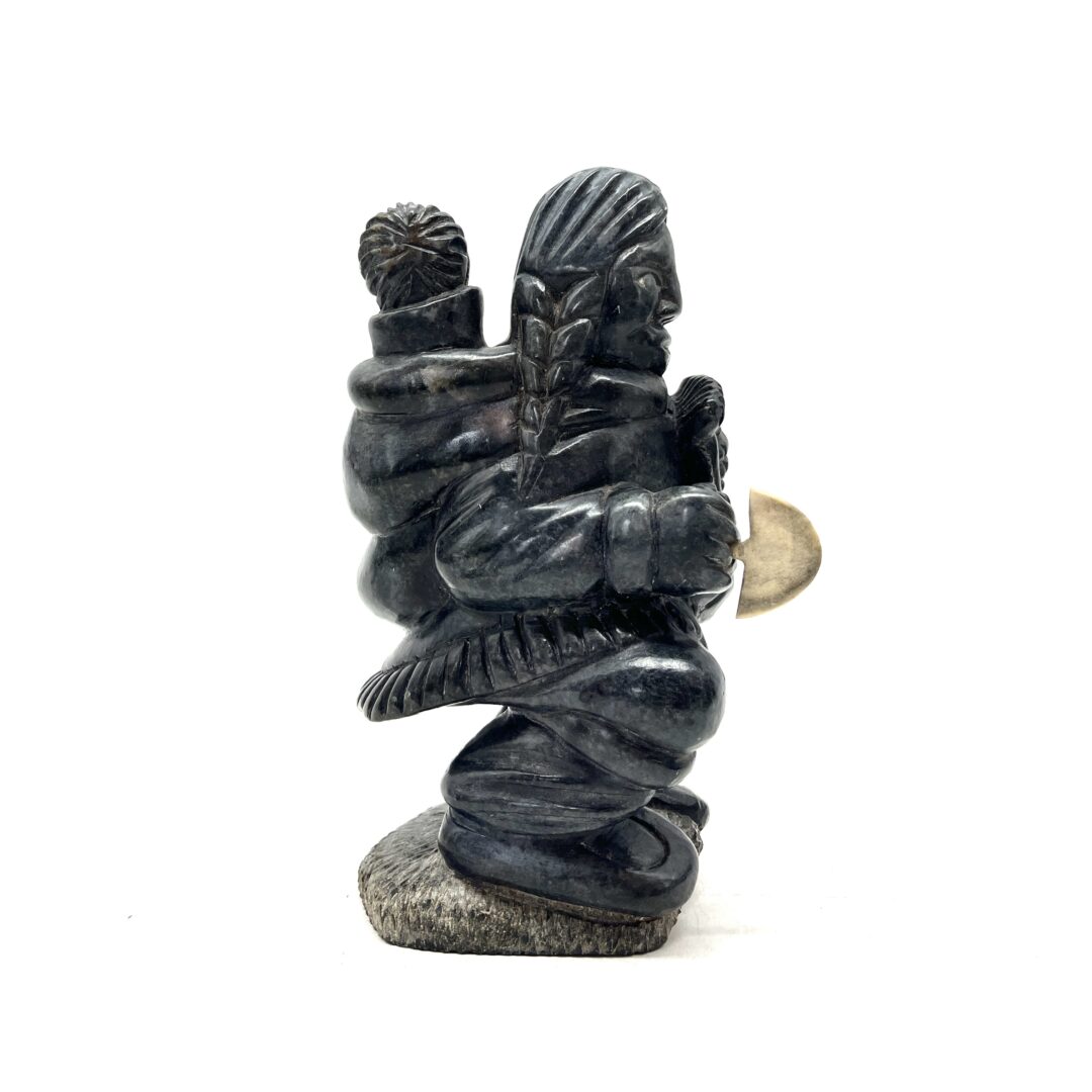 One original hand-carved sculpture by Inuit artist, Isa Aupaluktak. One mother and child carved out of serpentine.