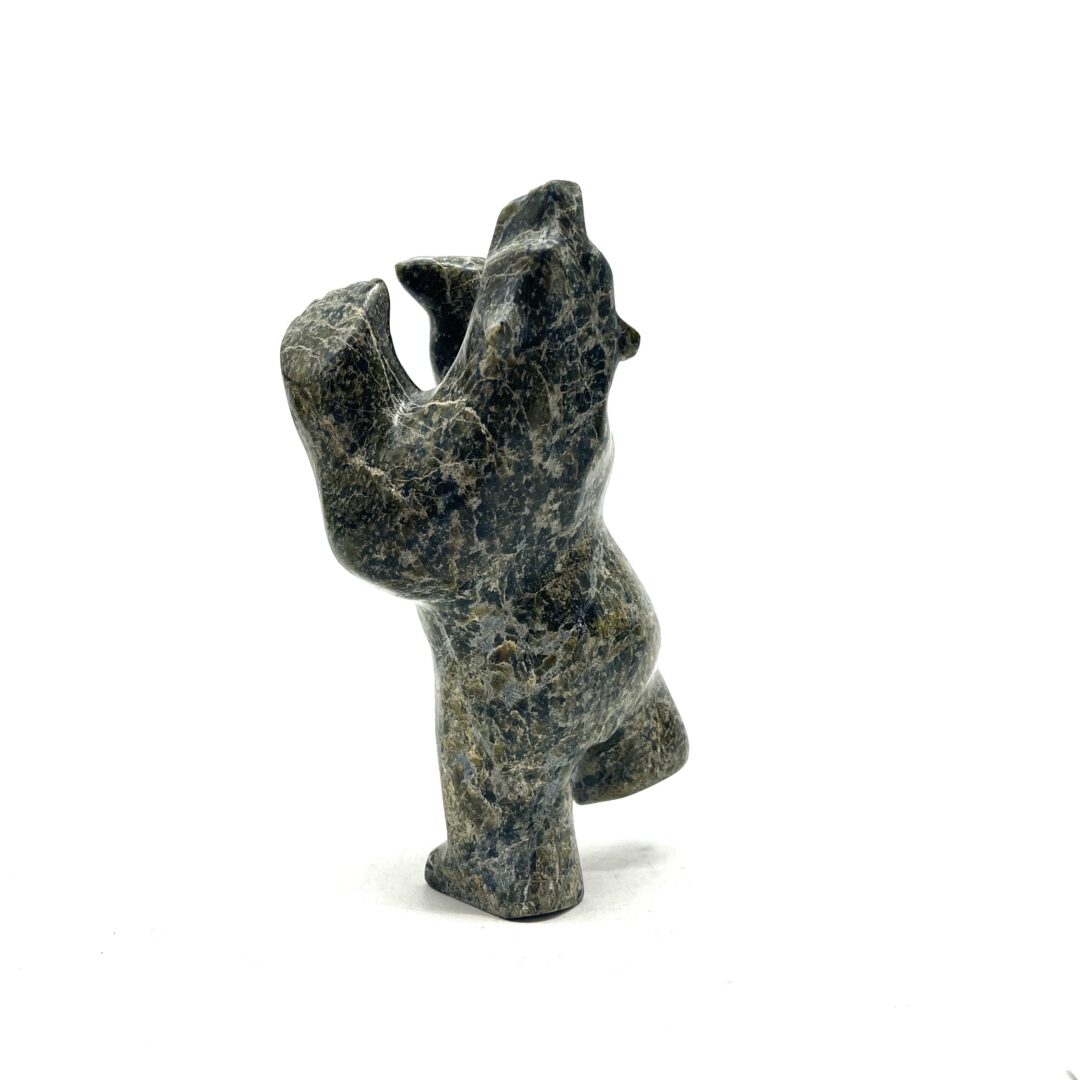 One original hand-carved sculpture by Inuit artist, Tony Oqutaq. One dancing bear carved out of serpentine.