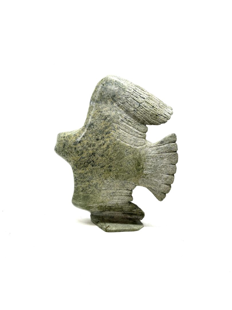 One original hand-carved sculpture by Inuit artist, David Panneok. One eagle in flight made out of serpentine.