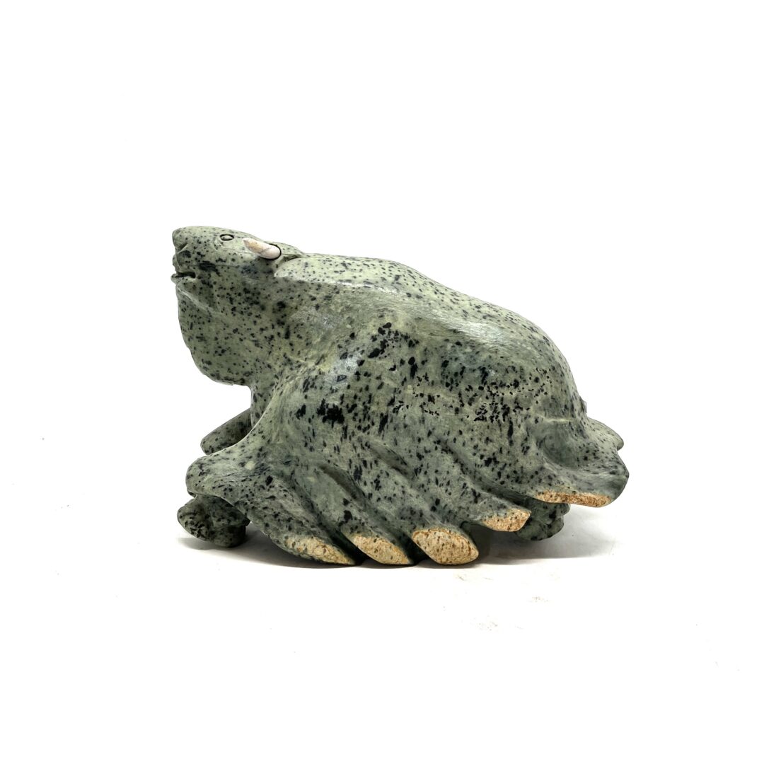 One original hand-carved sculpture by Inuit artist, Joanasie Faber. One musk-ox piece carved out of soapstone.