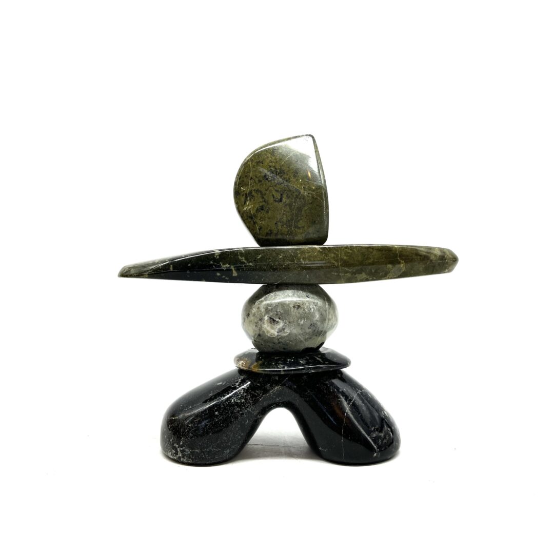 One original hand-carved sculpture by Ojibway artist, Paul Bruneau. One inukshuk made out of multiple stones of serpentine.