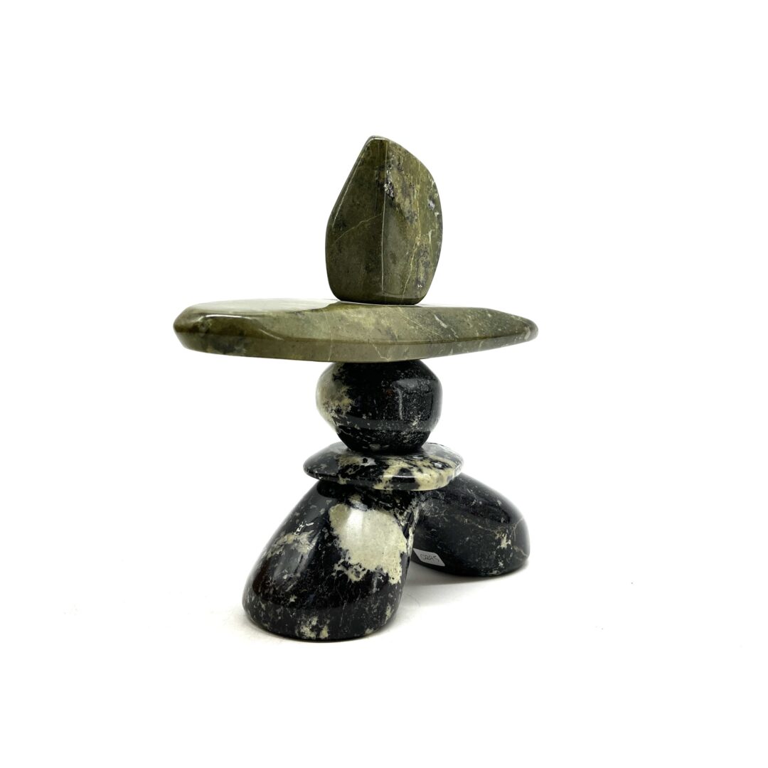 One original hand-carved sculpture by Ojibway artist, Paul Bruneau. One inukshuk made out of multiple stones of serpentine.