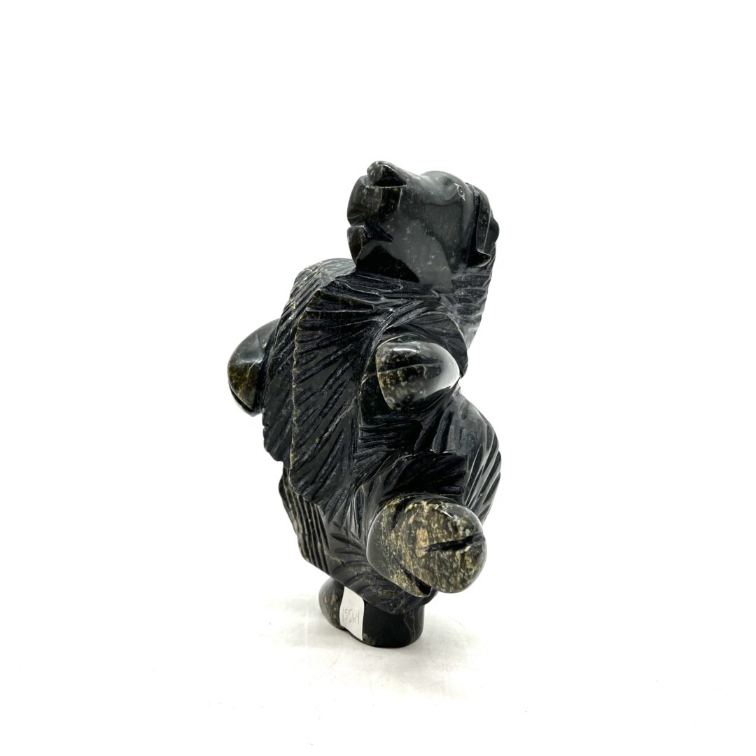 One original hand-carved sculpture by Inuit artist, Pitsulak Qimirpik. One dancing musk-ox made out of serpentine.