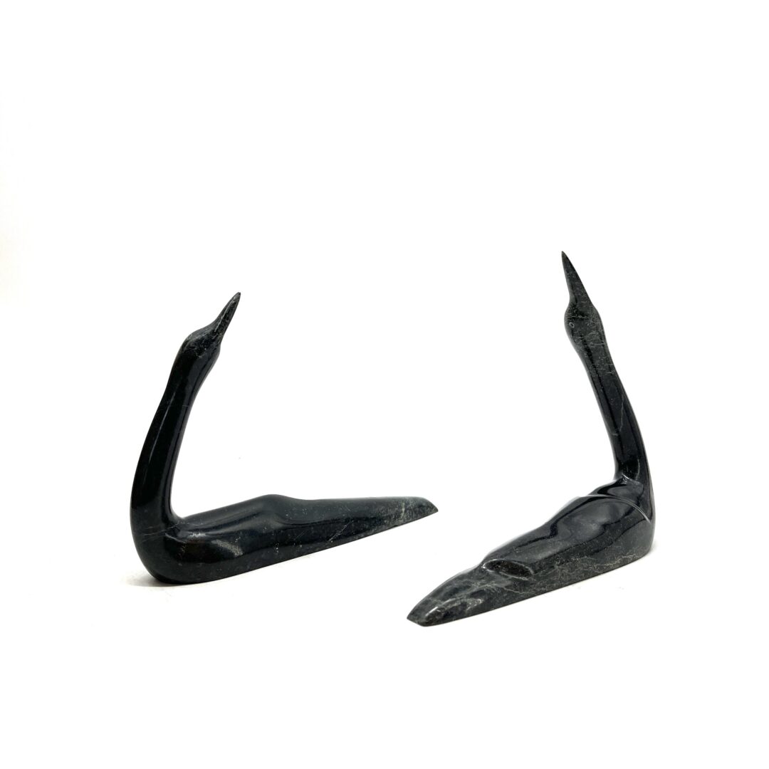 Two original hand-carved sculpture by Inuit artist, Ningeosiaq Ashoona. Two loons carved out of serpentine.