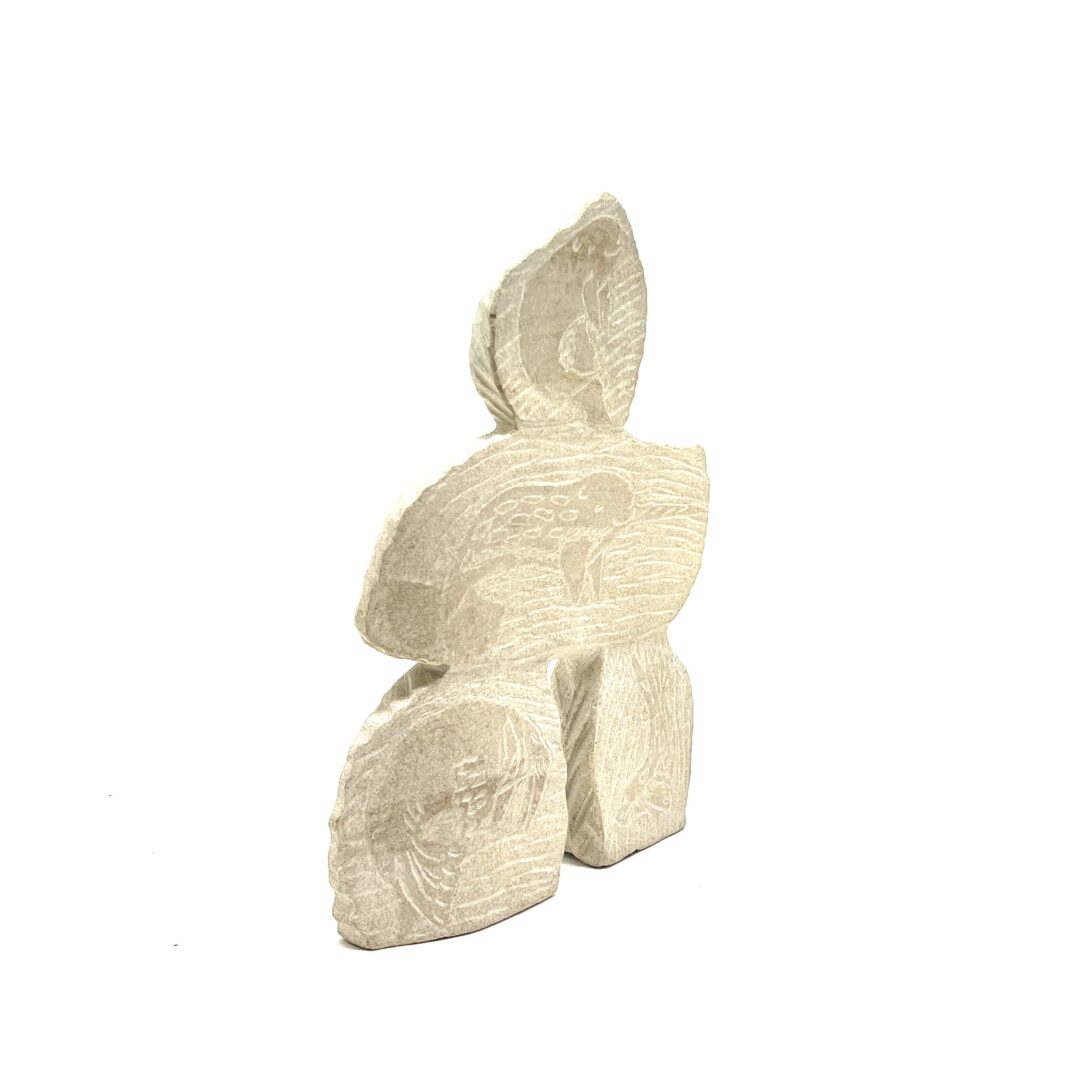 One original hand-carved sculpture by Inuit artist, Esa Kripanik. One inukshuk and collage carved out of sandstone.