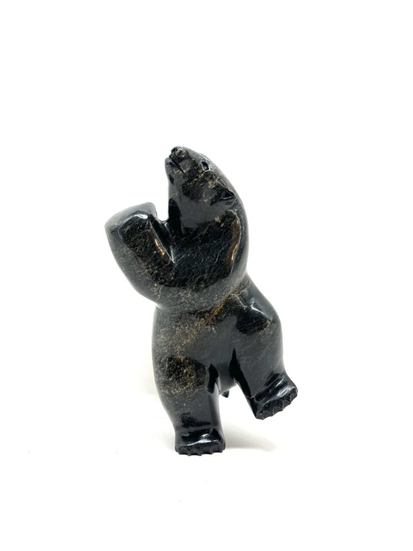 One original hand-carved sculpture by Inuit artist, Isaacie Petaulassie. One dancing bear carved out of serpentine.