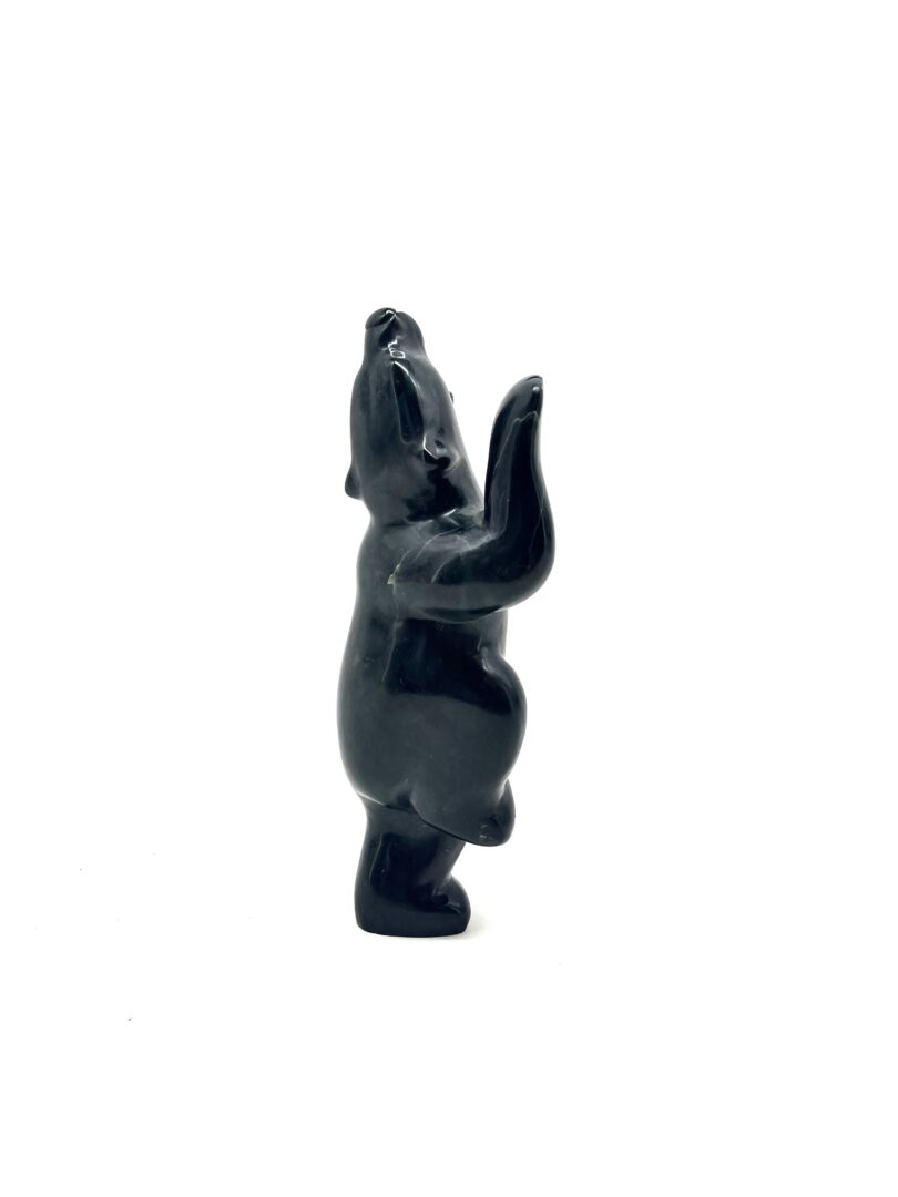 One original hand-carved sculpture by Inuit artist, Markoosie Papigatuk. One dancing bear carved out of serpentine.