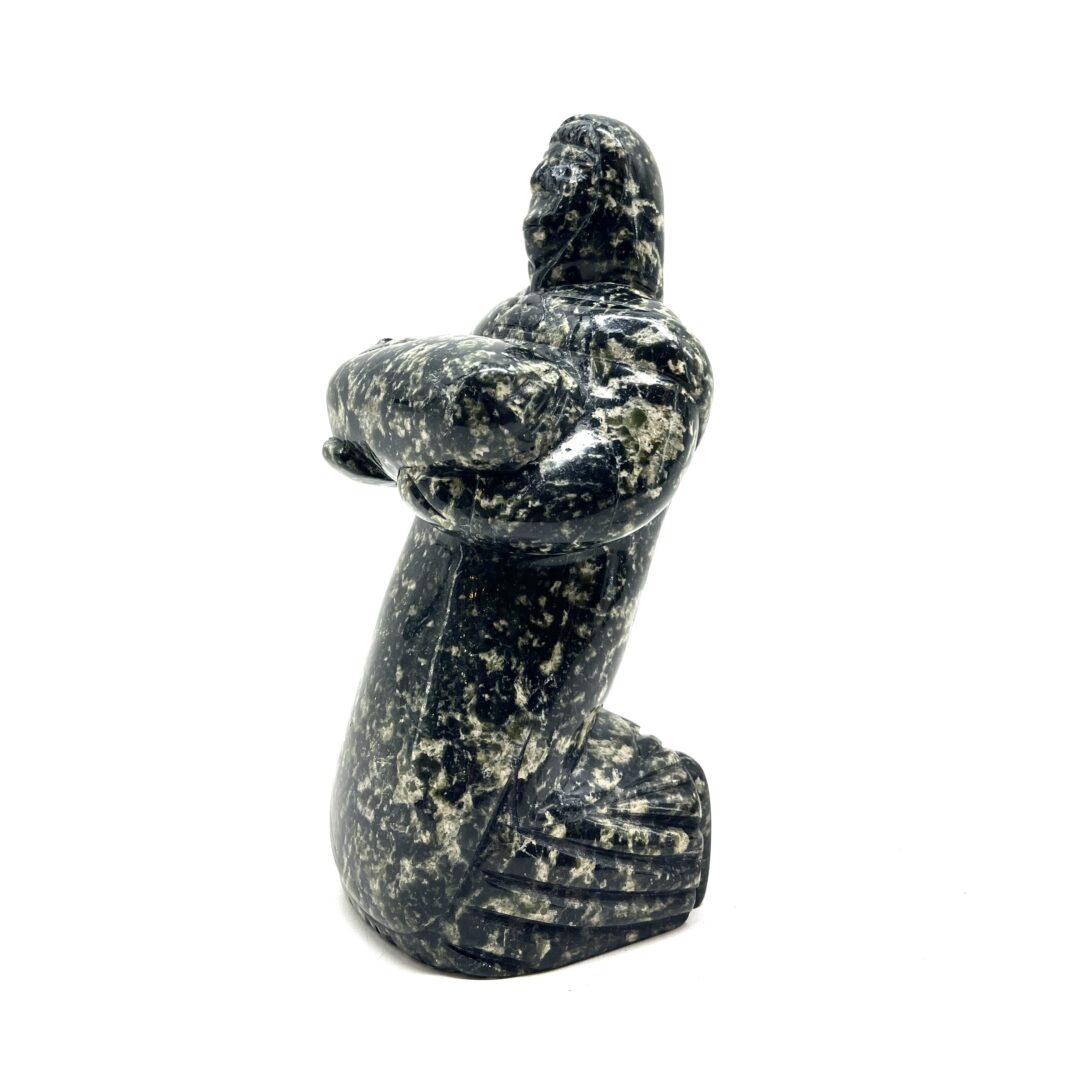 One original hand-carved by Inuit artist, Pitseolak Qimirpik. One mother and child carved out of serpentine.