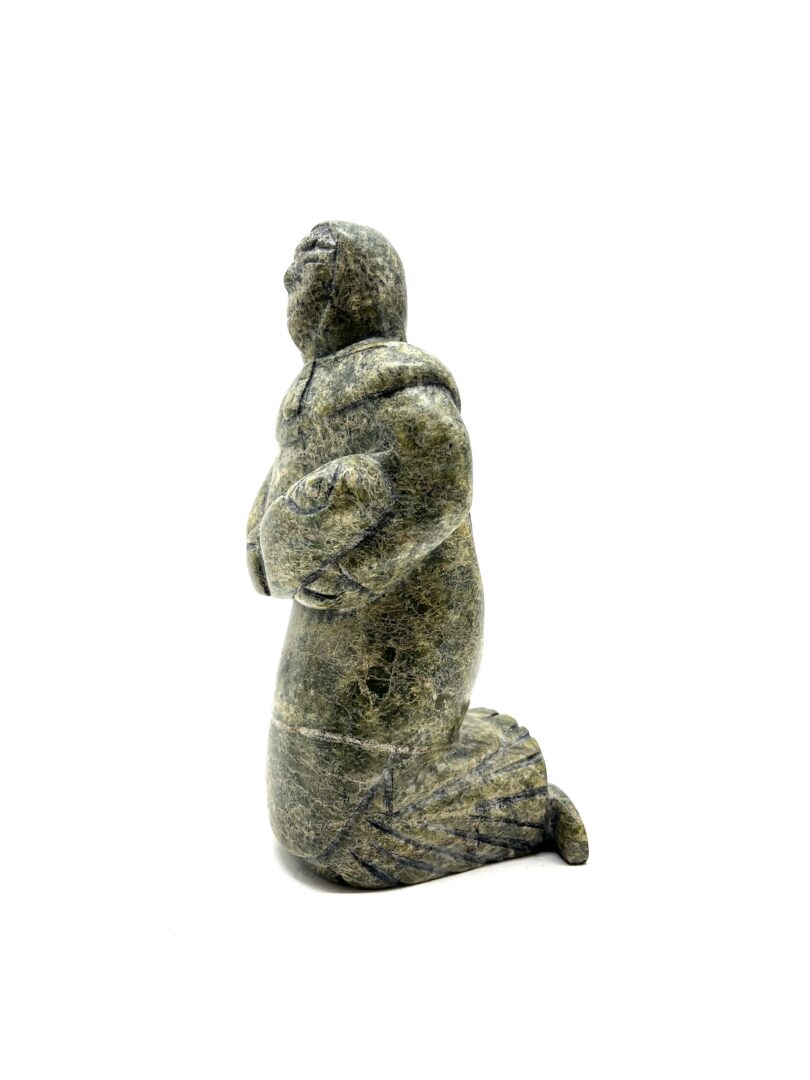 One original hand-carved sculpture by Inuit artist, Pitseolak Qimirpik. One mother and child carved out of serpentine.
