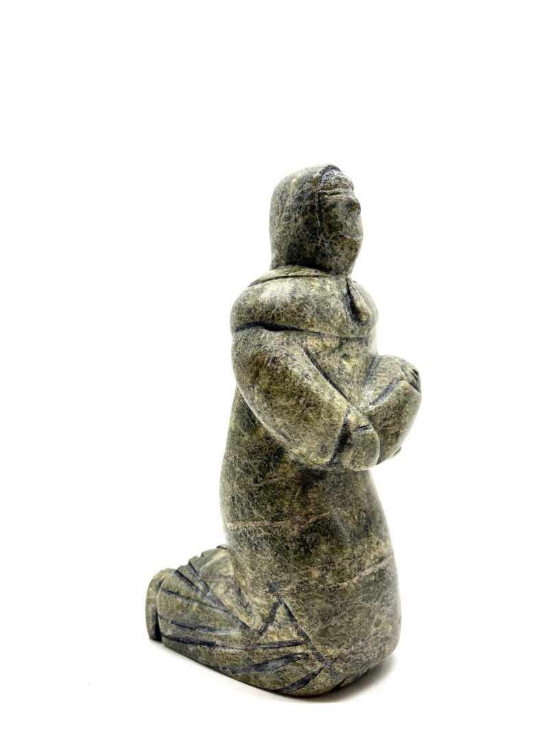 One original hand-carved sculpture by Inuit artist, Pitseolak Qimirpik. One mother and child carved out of serpentine.
